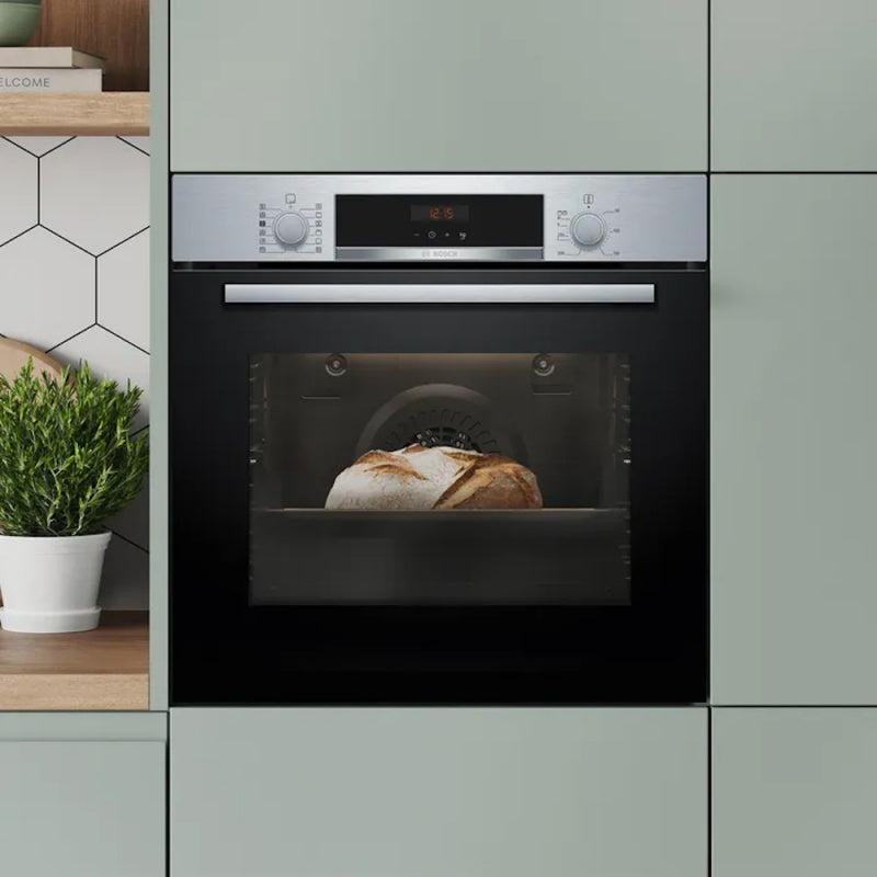Bosch Series 4 built-in oven with steam function in black, front view, showing bread being cooked